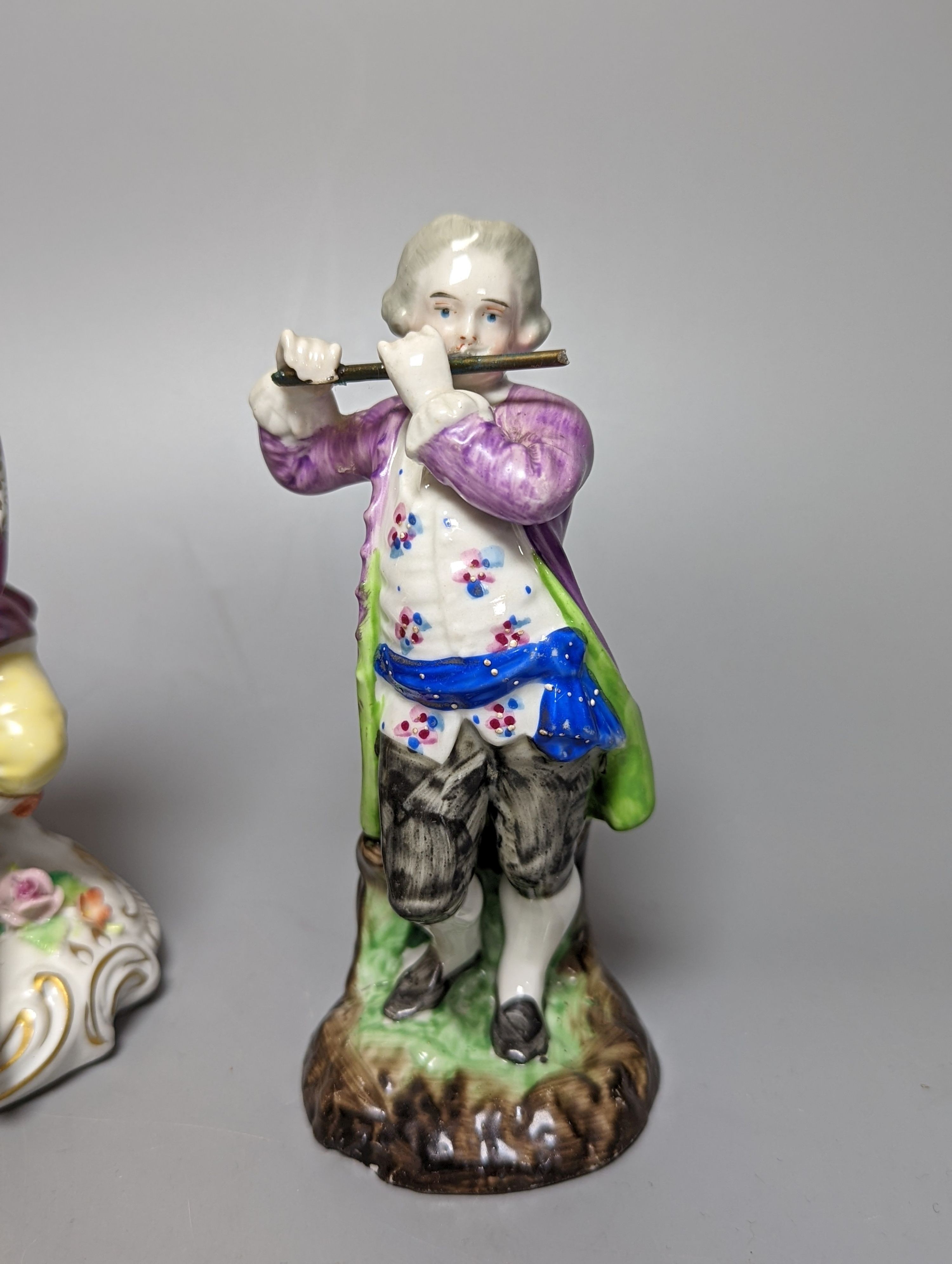 A late 19th century Meissen figure of a boy holding a garland of flowers, and a Sampson Hancock Derby figure and three other continental porcelain figures, tallest 18 cms high.